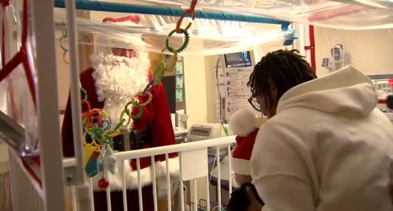 Santa Claus visits La Rabida Children's Hospital on Chicago's South Side on Christmas Day