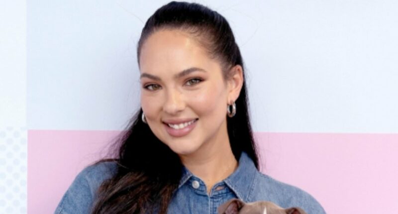 Sports Illustrated Swimsuit vet Christen Harper Goff snuggles puppies