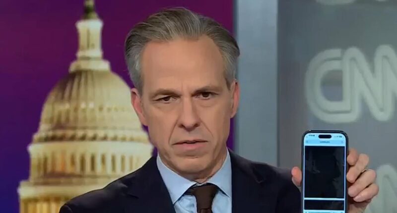 Stunned Jake Tapper scrolls through redactions in Epstein files on air