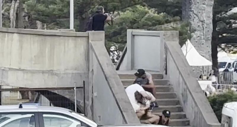 Stunning new video shows family hiding a metre from Bondi gunman