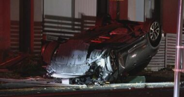 Two men were pulled from the overturned wreck of the Toyota Corolla.