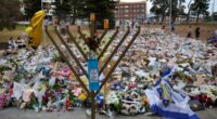 SYDNEY, AUSTRALIA - DECEMBER 21: General view of the memorial at Bondi Pavilion on December 21, 2025 in Sydney, Australia. Life slowly returned to normal at Bondi Beach, with people from all walks of life still paying respects and tributes as raw grief and funerals gave way to quiet commemorations. Police say at least 16 people, including one suspected gunman, were killed and more than 40 others injured when two attackers opened fire near a Hanukkah celebration at the world-famous Bondi Beach, i