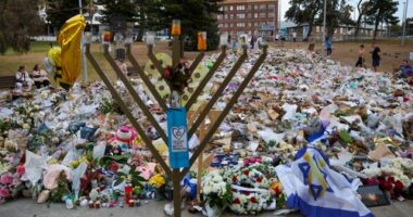 SYDNEY, AUSTRALIA - DECEMBER 21: General view of the memorial at Bondi Pavilion on December 21, 2025 in Sydney, Australia. Life slowly returned to normal at Bondi Beach, with people from all walks of life still paying respects and tributes as raw grief and funerals gave way to quiet commemorations. Police say at least 16 people, including one suspected gunman, were killed and more than 40 others injured when two attackers opened fire near a Hanukkah celebration at the world-famous Bondi Beach, i