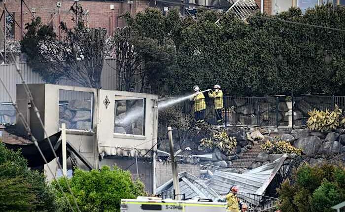 Wildfires destroy 40 homes and kill a firefighter in Australia