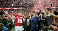 Indiana completes undefeated season and wins first national title, beating Miami 27-21 in CFP final
