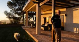 A man and his old dog are home at last after fleeing LA area fires