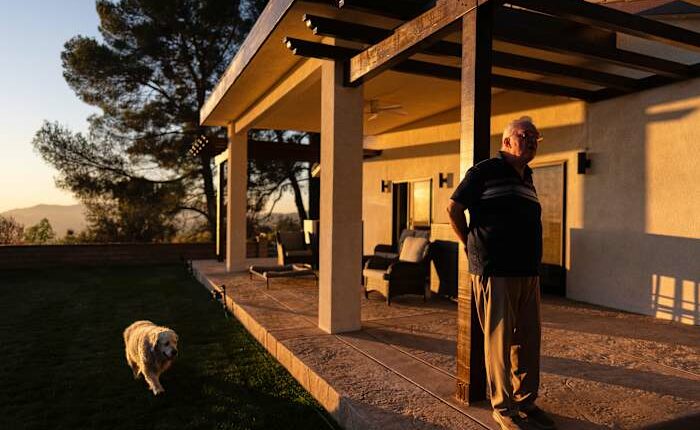 A man and his old dog are home at last after fleeing LA area fires
