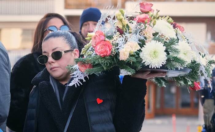 A mother says goodbye to her son as Swiss community grieves after deadly fire