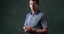 Alex Honnold is climbing Taipei 101 with no ropes, live on TV. It's drawing excitement — and concern