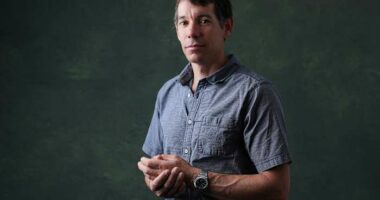 Alex Honnold is climbing Taipei 101 with no ropes, live on TV. It's drawing excitement — and concern