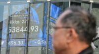 Asian shares, US futures gain as Japan keeps its key interest rate unchanged