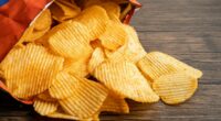 Britons eat the 'equivalent of 22 packets of crisps a day' in salt, increasing their risk of developing heart failure, dementia and diabetes