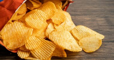 Britons eat the 'equivalent of 22 packets of crisps a day' in salt, increasing their risk of developing heart failure, dementia and diabetes