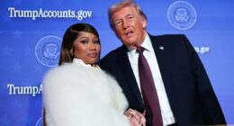 Careful she doesn't cut you, Donald! Nicki Minaj flashes dagger-long nails as she clutches Trump's hand after gushing she's his No. 1 fan