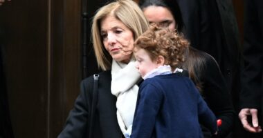 Caroline Kennedy holds granddaughter at Tatiana Schlossberg's funeral