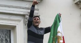 Dissidents remove Iranian flag from embassy as thousands protest in UK