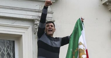 Dissidents remove Iranian flag from embassy as thousands protest in UK