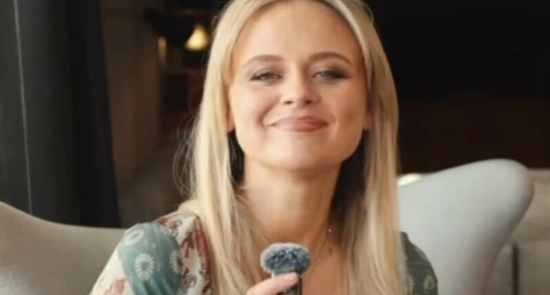 Emily Atack shows off her dramatic body transformation in a plunging midi dress as she films a new video opening about parenting