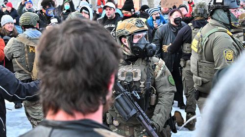 Heavily armed ICE agents face off with protesters in Minnesota.