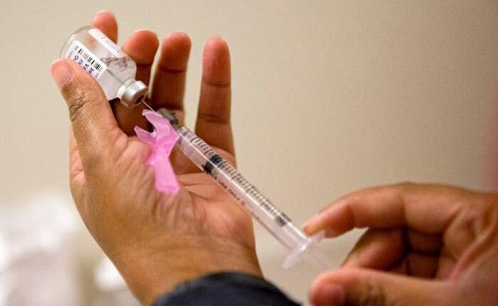 Flu season surged in the US over the holiday and already rivals last winter's harsh epidemic