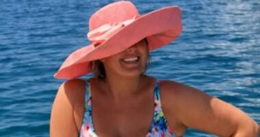 Gemma Collins, 44, looks incredible in a blue floral swimsuit as she shows off her amazing weight loss during a sun-soaked boat trip on holiday