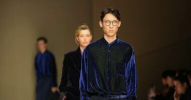 Giorgio Armani launches new era with iridescent colors and a star-studded front row