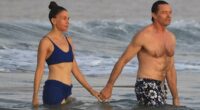 Hugh Jackman and Sutton Foster pack on the PDA after 'jealousy' claims