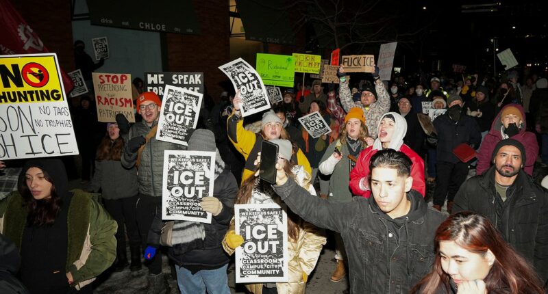 Hundreds of masked anti-ICE protesters besiege Minneapolis hotel