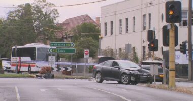 Man charged after allegedly stolen car crashes into school bus, drives at police