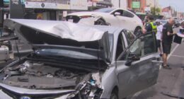 Man restrained by passersby after car crashes into multiple others on busy road