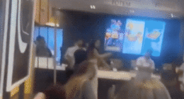 McDonald's customer caught on camera launching flying kick at employee during heated brawl