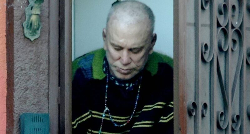 Mickey Rourke emerges at home he faces eviction from over unpaid rent