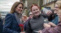 Moment Kate sprints past her security to greet a fan with flowers