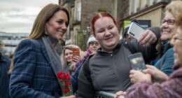 Moment Kate sprints past her security to greet a fan with flowers