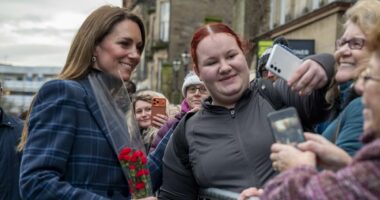 Moment Kate sprints past her security to greet a fan with flowers