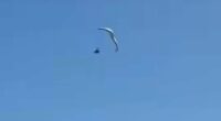 Moment paraglider plunges into ocean from 500ft in the air