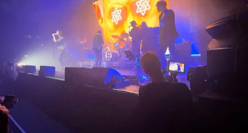 Primal Scream under fire for showing allegedly antisemitic images on stage at a London gig