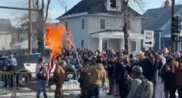 Protesters burn flag after woman shot dead by ICE in Minneapolis