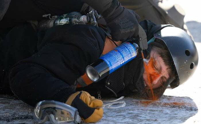 Protesters demand immigration agents leave Minneapolis after man is shot and killed during crackdown