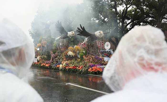 Rain soaks Rose Parade in California and snow squalls hit Midwest and Northeast on first day of 2026