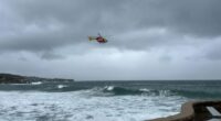 Searches resume for two people missing at NSW beaches after spate of drownings