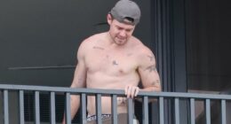 Shirtless and smiling Lachie Neale enjoys a housewarming at his new bachelor pad... as he faces the toughest call of his career