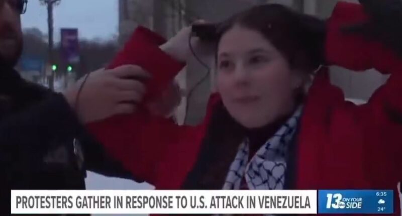 Shocking moment woman is arrested during live TV interview