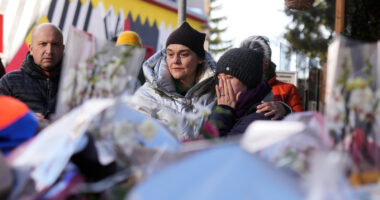 Swiss investigators believe sparkling flares atop wine bottles ignited fatal bar fire