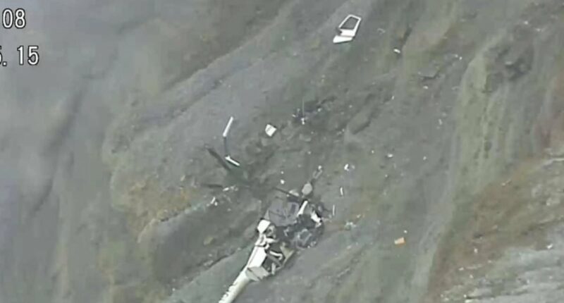 Tourist helicopter vanishes over Japan volcano - wreckage 'in crater'