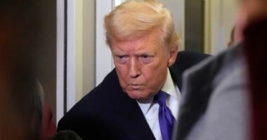 President Donald Trump listens to a reporter's question as he flies aboard Air Force One from Joint Base Andrews, Md., to West Palm Beach, Fla., Friday, Feb. 6, 2026