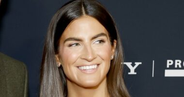 CNN host Kaitlan Collins arrives at the Grammys with mystery man by her side