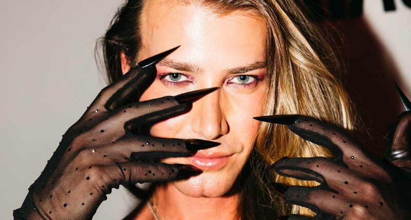 Christian Wilkins wears sheer fingernail gloves to Peggy Gou's show