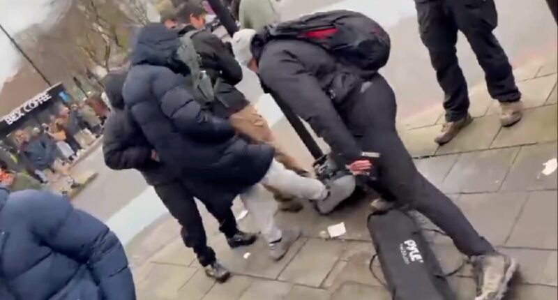 Christian preacher is pushed and has equipment attacked by Muslim men