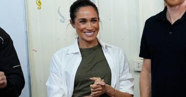 Down-to-earth Duchess! Meghan has no time to worry about creased trousers as she proudly focuses on her work in Jordan - with no entourage and no 6ft ironing board like Andrew's valet used to carry around